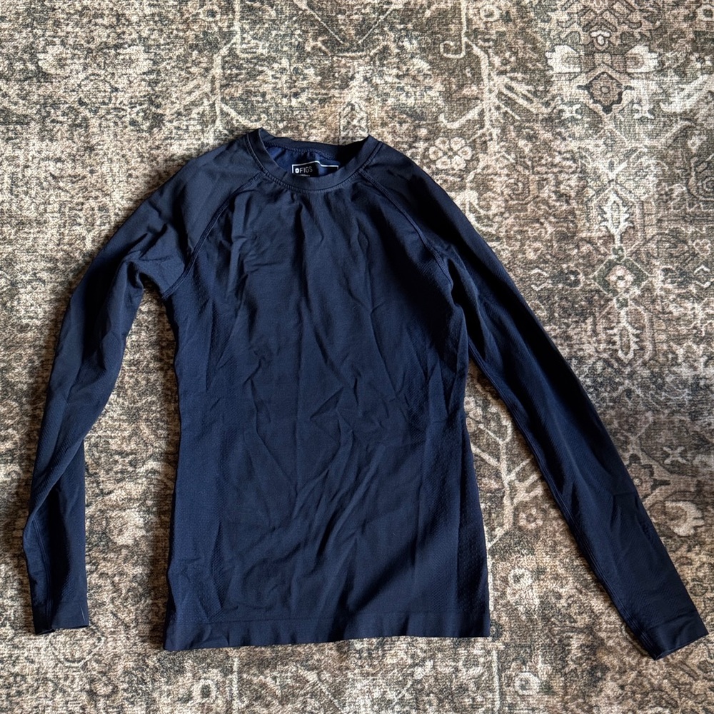 Figs under scrub shirt